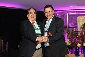 Former President Rob Shibata, AAF, President of Mt. Eden Floral Company LLC passed the gavel to President Santiago Cock-Rada, General Manager of Liberty Blooms. Santiago is the first Colombian president of WF&FSA. Photo courtesy WF&FSA