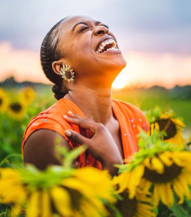 african american female of sunflowers Ebony Archie, one of the winners of Pugh Flowers’ sunflower photo contest, received more than 100 likes for her entry.