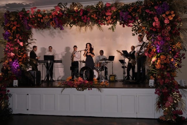 Before a crowd of wedding vendors, longtime clients, family and close friends, Ian Prosser, AAF, AIFD, PFCI, who founded Botanica with his wife, Fiona, AAF, retraced the business’s roots from an 800-square-foot retail shop to an upscale event company